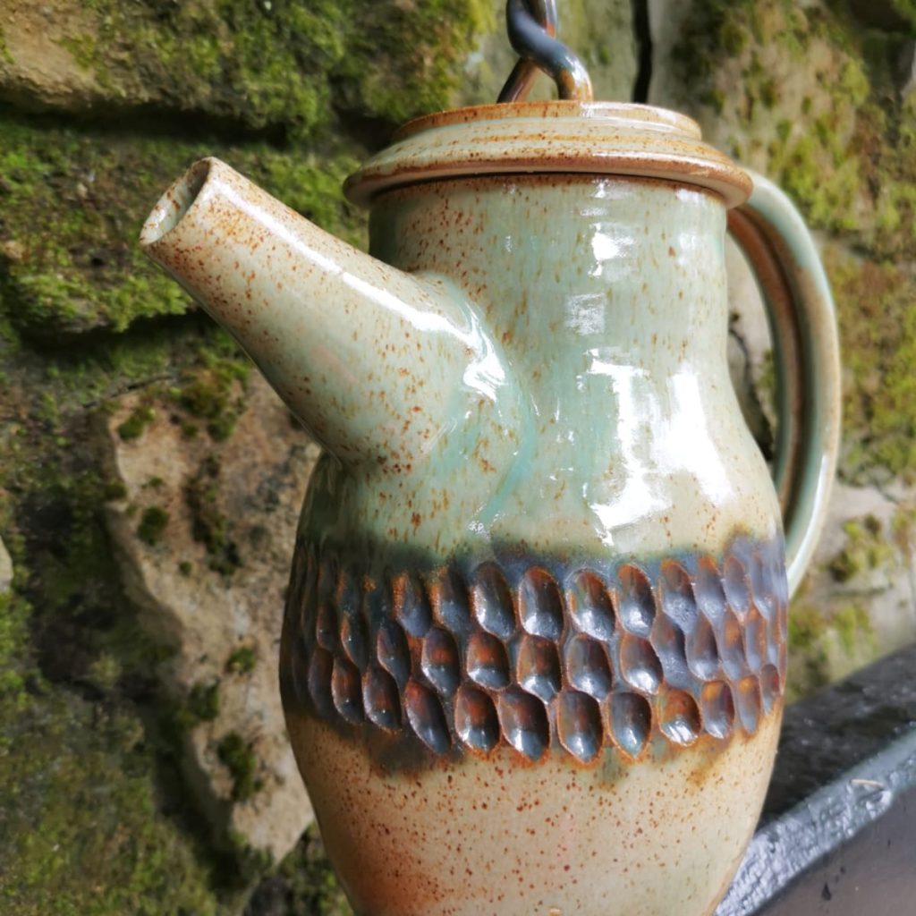 A ceramic teapot.